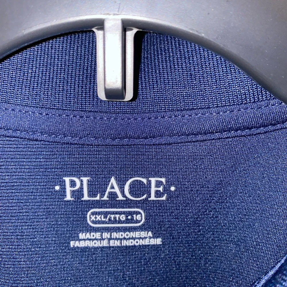 Boys navy blue uniform polo. 100% polyester. - Picture 2 of 4